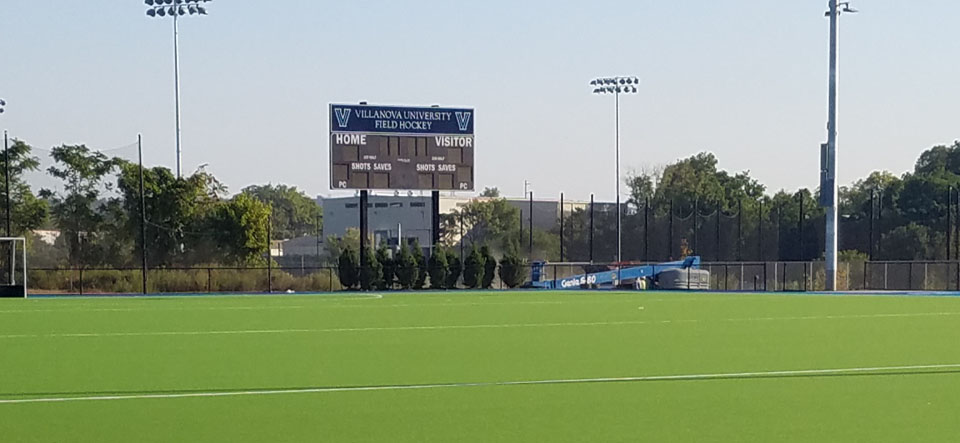 field hockey field with scoreboard in background