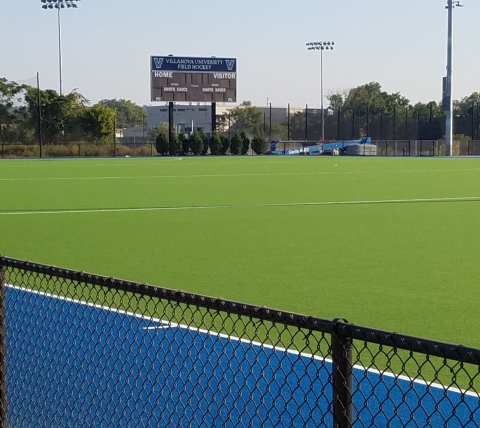 field hockey field with scoreboard in background