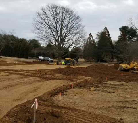 site work with excavating equipment at church