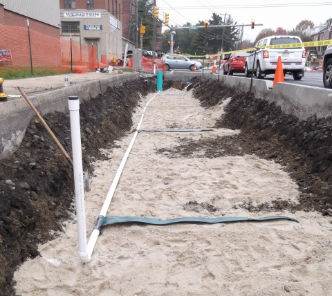 in-progress sidewalk installation with porous paving