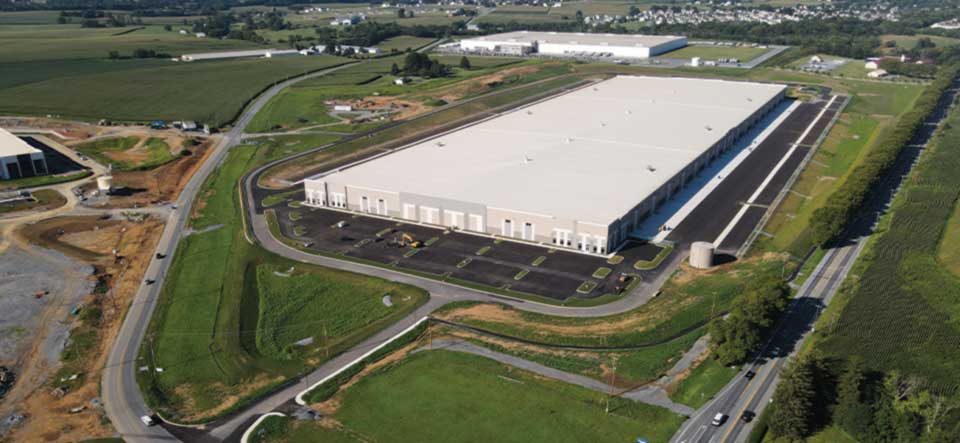 aerial view of in-progress warehouse and accompanying site work and excavating