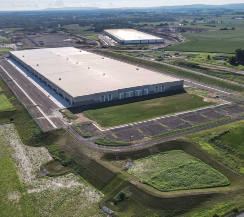 aerial view of in-progress warehouse and accompanying site work and excavating