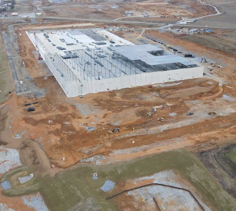 aerial view of large warehouse building under construction