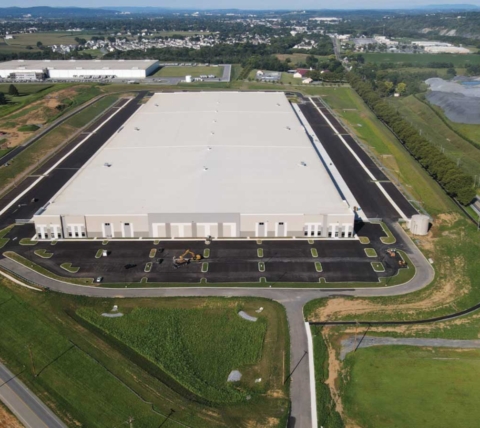 aerial view of in-progress warehouse and accompanying site work and excavating