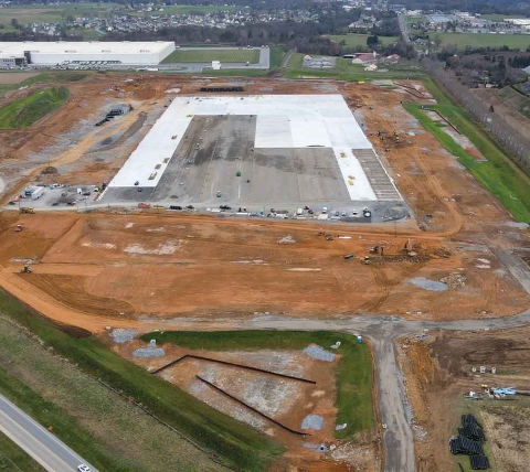 aerial view of large warehouse building pad under construction