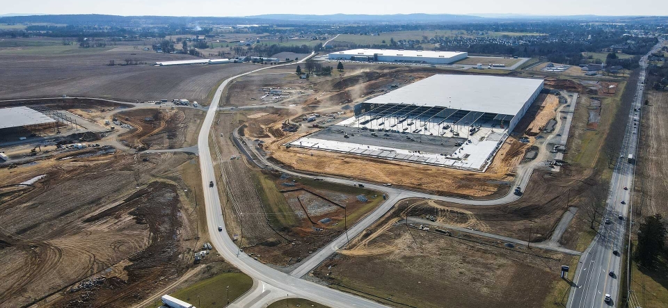 aerial view of large warehouse building under construction