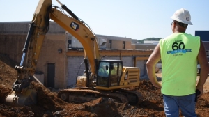 horst excavating employee and excavator on jobsite