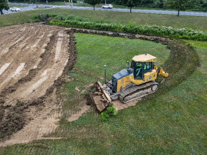 dozer clearing grass