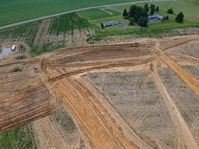 scrapers clearing land