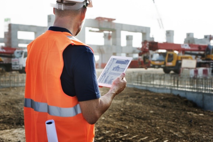 construction worker on ipad